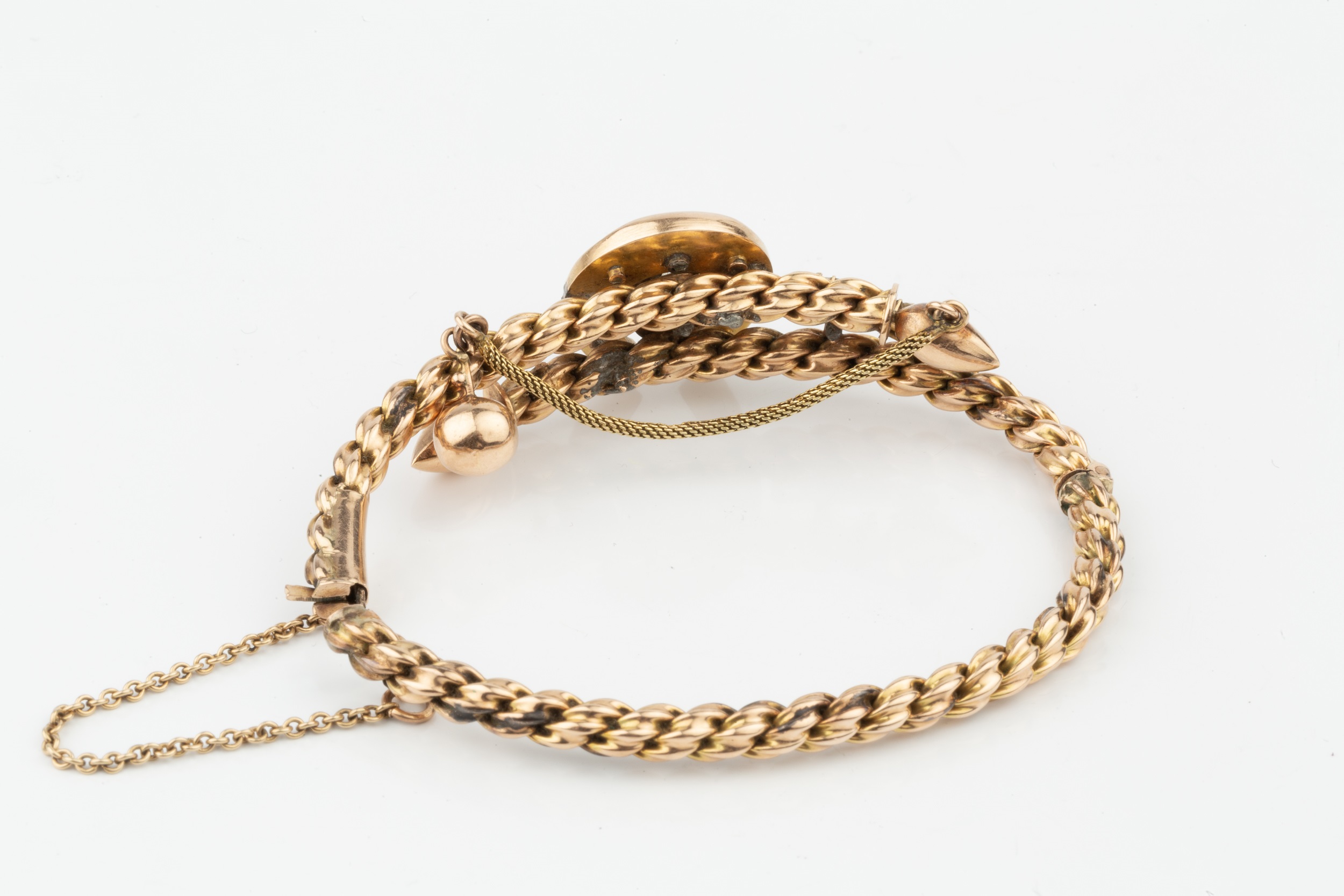 A Victorian gold hinged ropetwist bangle, of crossover design set with a horseshoe motif centred - Image 2 of 2