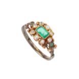 A 19th century emerald and diamond ring, the rectangular step cut emerald within a border of eight