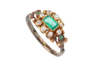 A 19th century emerald and diamond ring, the rectangular step cut emerald within a border of eight