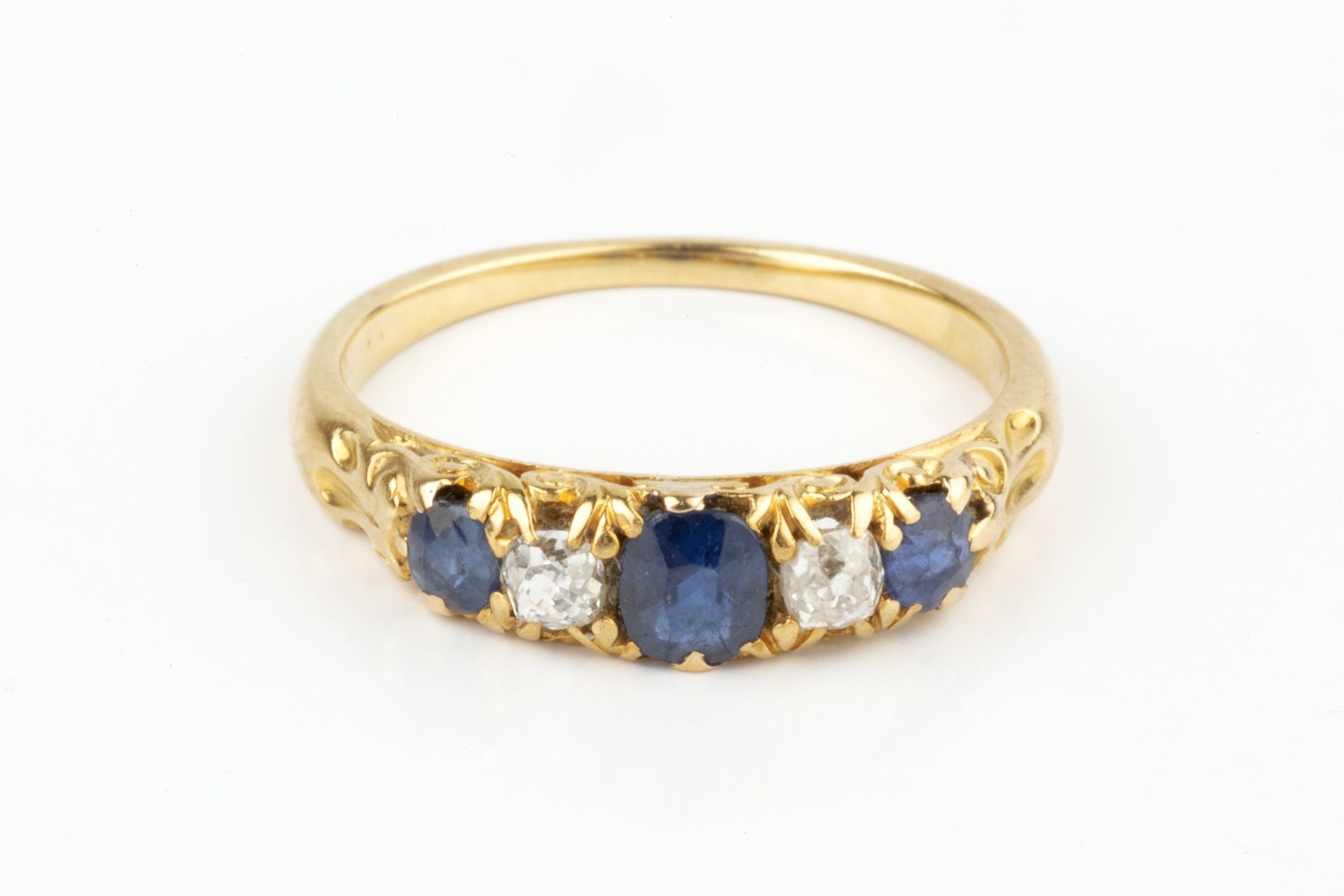 A sapphire and diamond five stone ring, the three graduated circular sapphires flanking two old - Image 4 of 4