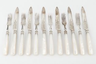 A set of six late Victorian silver dessert knives and forks, with engraved decoration, and mother
