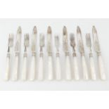 A set of six late Victorian silver dessert knives and forks, with engraved decoration, and mother