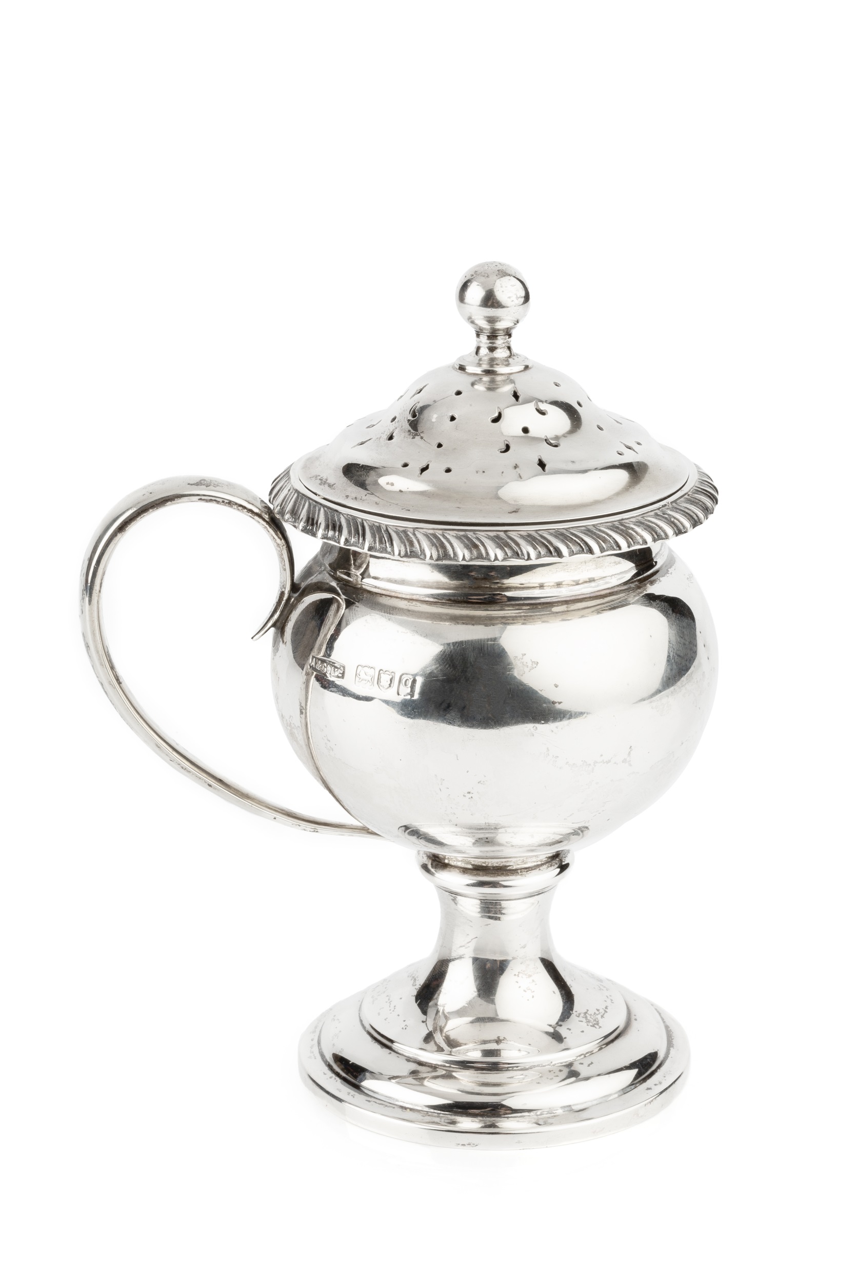 A George V silver sugar sifter, with gadrooned border, rounded body, side handle and circular