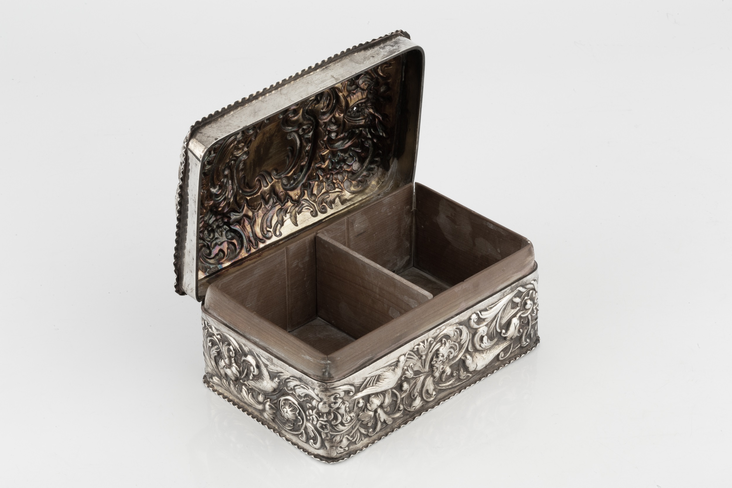 A late Victorian silver cigarette box, with domed hinged top, repoussé decorated with birds, flowers - Image 2 of 6