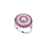 A ruby and diamond cocktail ring, of target design, centred with an old cut diamond within a