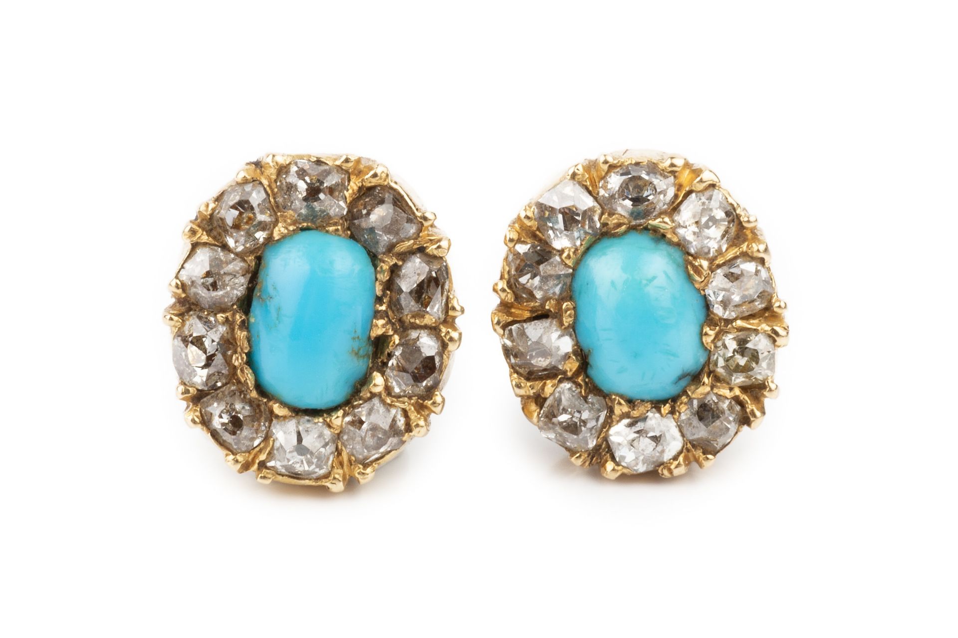 A pair of turquoise and diamond ear studs, each with central oval cabochon turquoise within a border