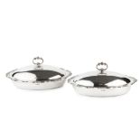 A pair of Edwardian silver oval entree dishes and covers, with beaded scroll cast borders and loop