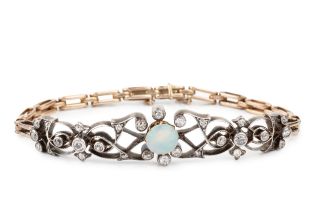 An opal and diamond set panel bracelet, featuring ornate arabesque scroll work in white metal,