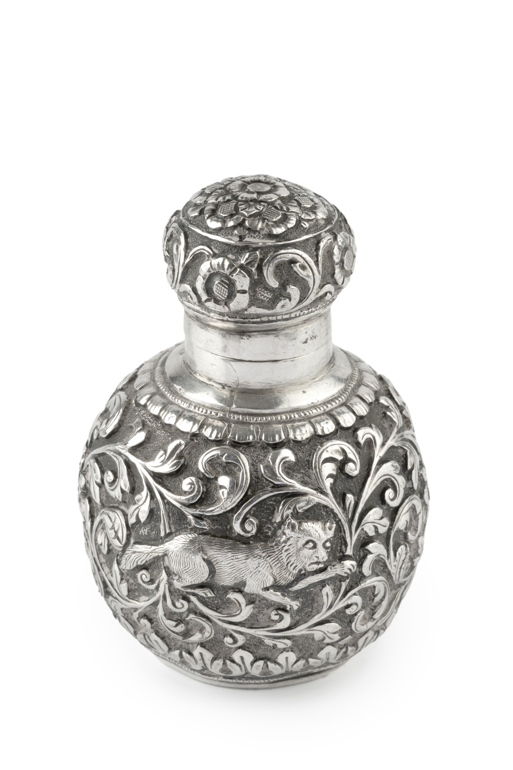 A late 19th century Anglo-Indian silver scent bottle, of globular form, embossed and engraved with a