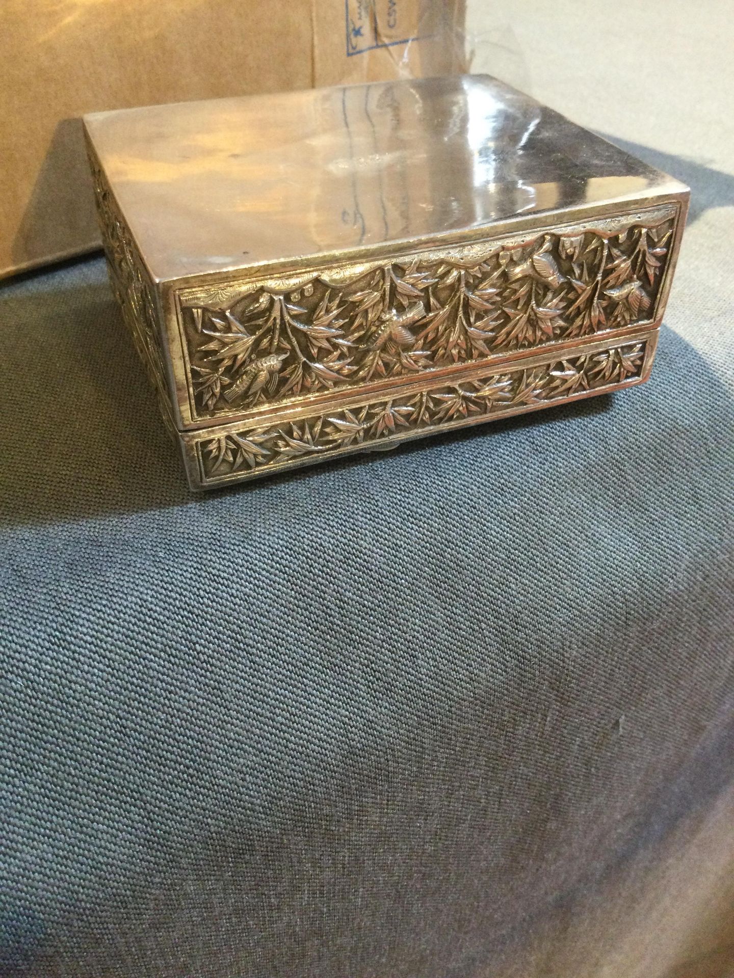 A Chinese silver rectangular box, with hinged cover, embossed and engraved with dragons amidst - Image 3 of 10