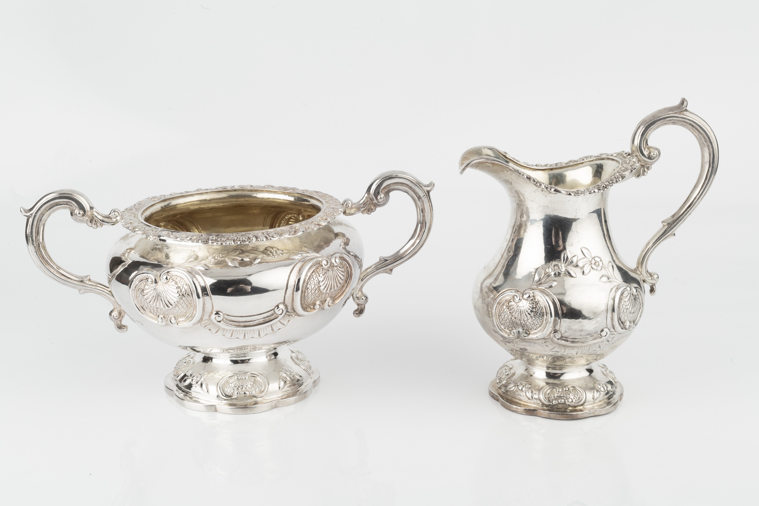 An early Victorian silver twin handled sucrier, and matching milk jug, with floral, scallop and C- - Image 2 of 2