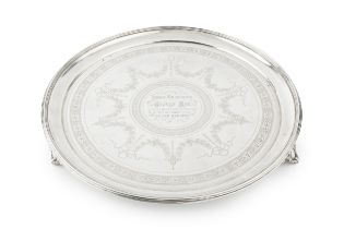A late Victorian silver circular salver, with reeded border and engraved with garlands of ribbon