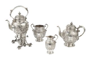 A late Victorian Scottish silver four piece tea service, embossed and chased with classical