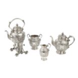 A late Victorian Scottish silver four piece tea service, embossed and chased with classical