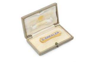 An 18ct yellow gold bar brooch, of angular design, with inset blue enamel name 'G. Drexler', stamped