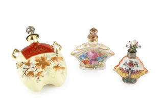 A late 19th century Continental porcelain scent bottle, of shaped and compressed form, painted in