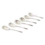 A set of six late Victorian silver apostle top serving spoons, with twist stems and scalloped