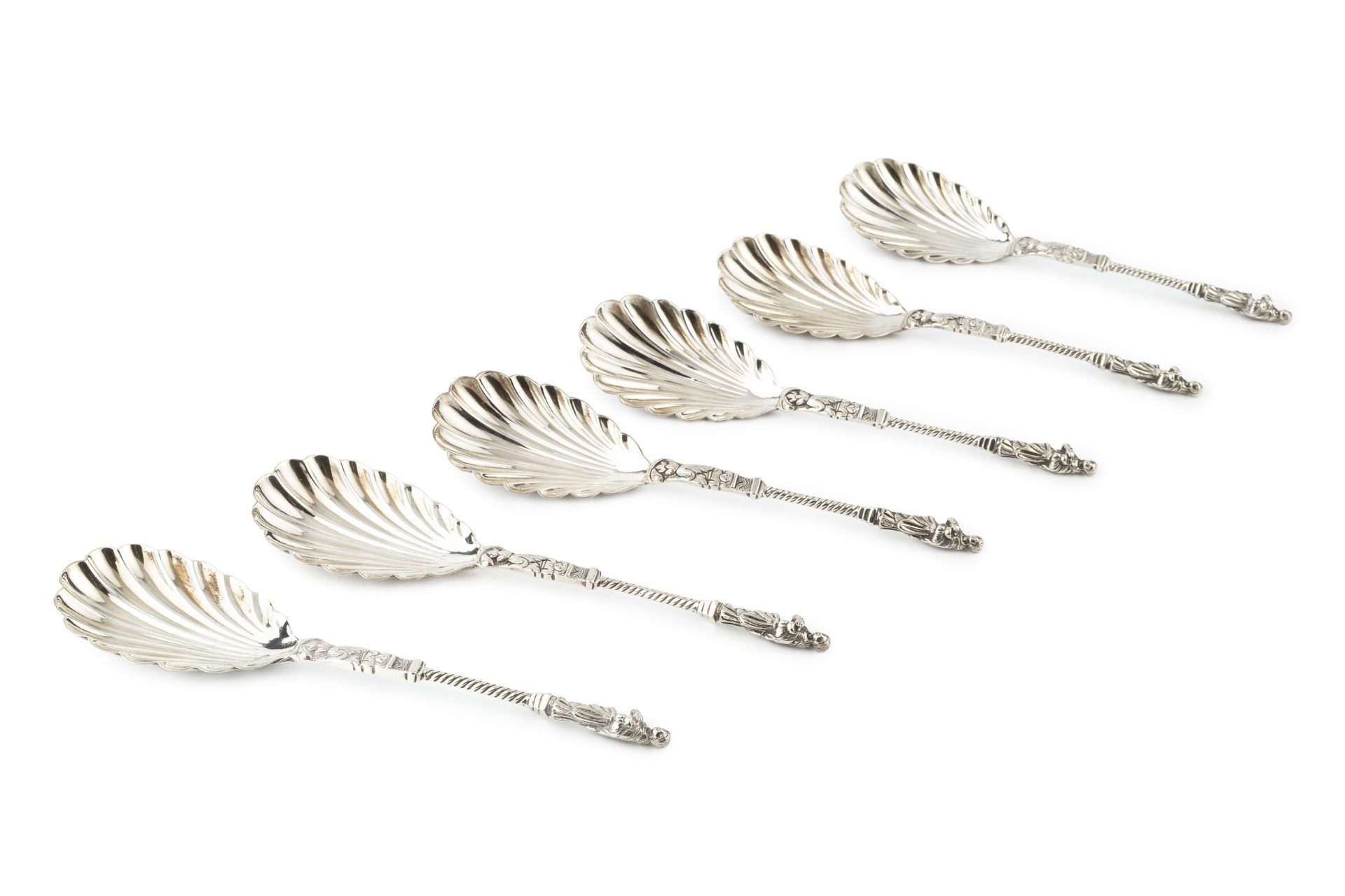 A set of six late Victorian silver apostle top serving spoons, with twist stems and scalloped