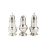 A pair of early George III silver baluster small castors, with girdled bodies and pierced and