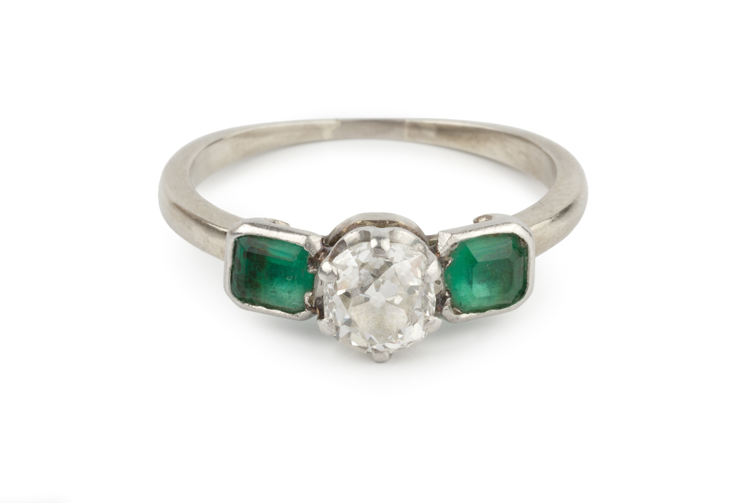 A diamond and emerald three stone ring, the central old-cut diamond in claw setting, between two - Image 2 of 4
