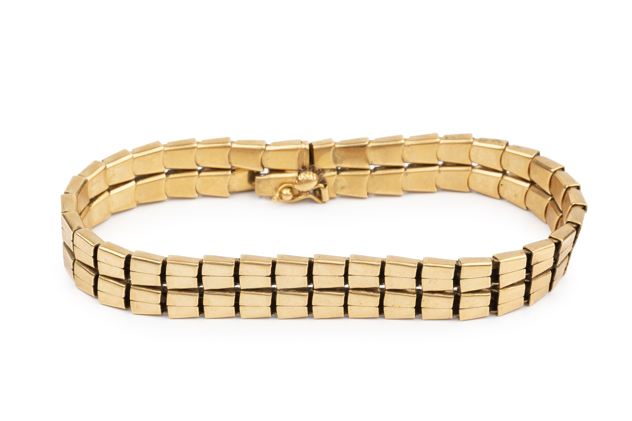 An 18ct gold bracelet, composed of two rows of flexible tapered rectangular links, the clasp stamped