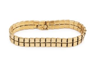 An 18ct gold bracelet, composed of two rows of flexible tapered rectangular links, the clasp stamped