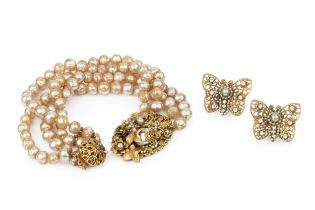 A faux baroque pearl bracelet by Miriam Haskell, of four strand design with signed oval foliate