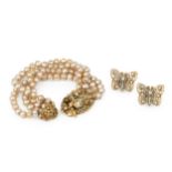 A faux baroque pearl bracelet by Miriam Haskell, of four strand design with signed oval foliate