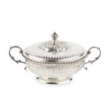 A George V silver twin handled shallow bowl and cover, with gadrooned border, fluted decoration,