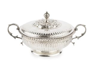 A George V silver twin handled shallow bowl and cover, with gadrooned border, fluted decoration,
