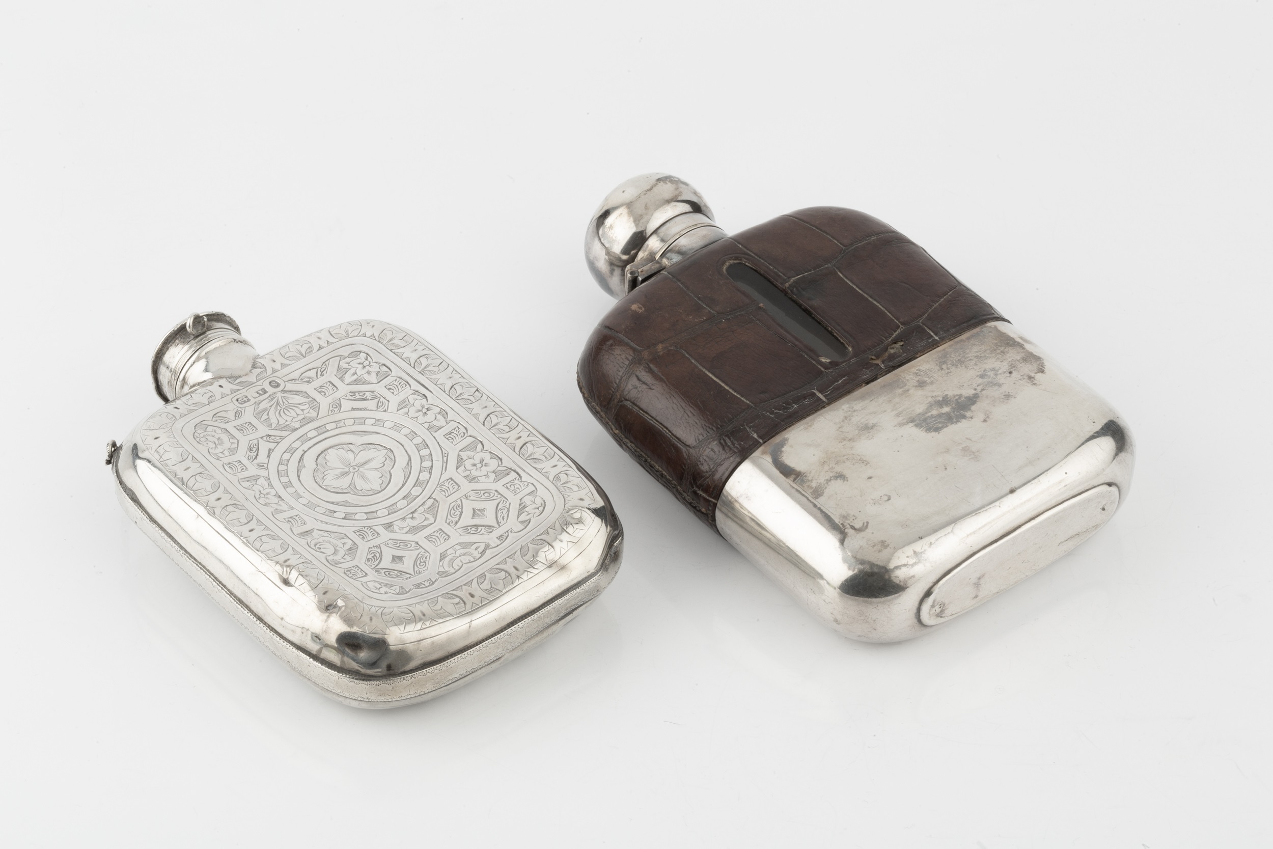 A mid Victorian silver hip flask, of curved and rounded form, engraved with stylised foliage and - Image 2 of 2