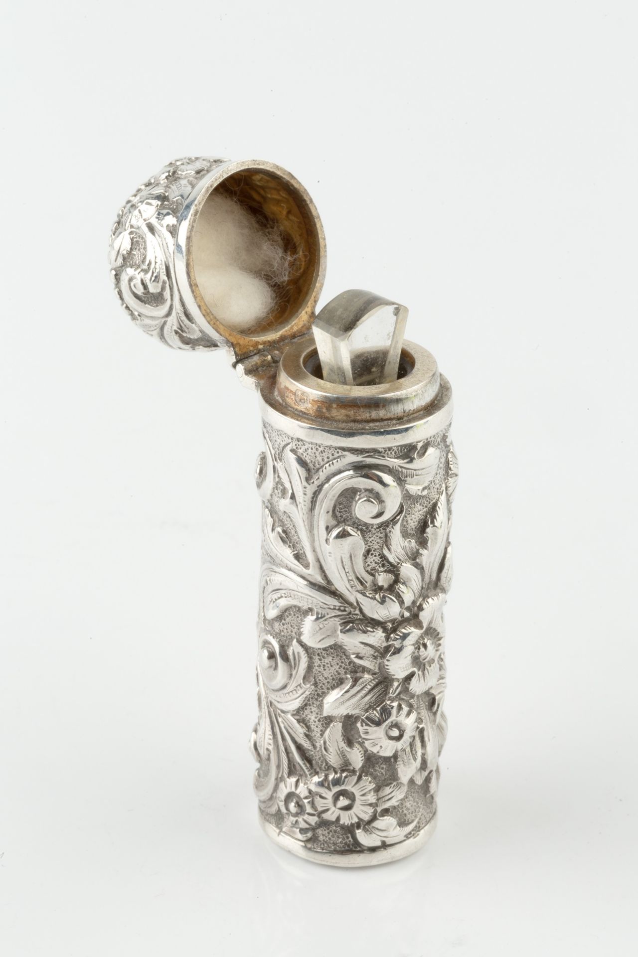 A late Victorian silver cylindrical scent bottle, embossed and engraved with stylised scrolling - Image 4 of 4
