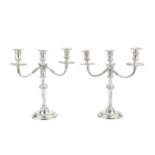 A pair of silver three light candelabra, the detachable branches with reeded arms and gadrooned drip