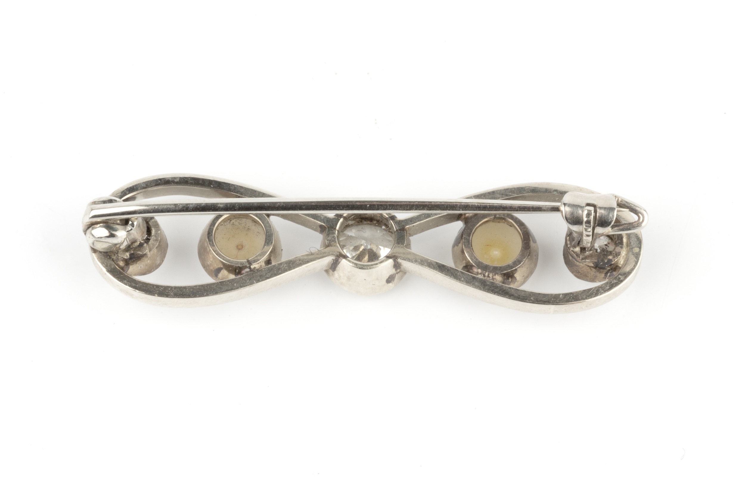 A diamond and half pearl bow brooch, centred with an old brilliant-cut diamond in millegrain - Image 2 of 2