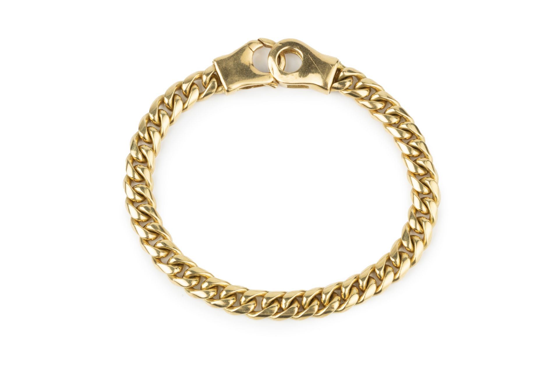 An 18ct gold curb link bracelet, the clasps stamped 750, 18.5cm long Weight approx 32.4g Width circa