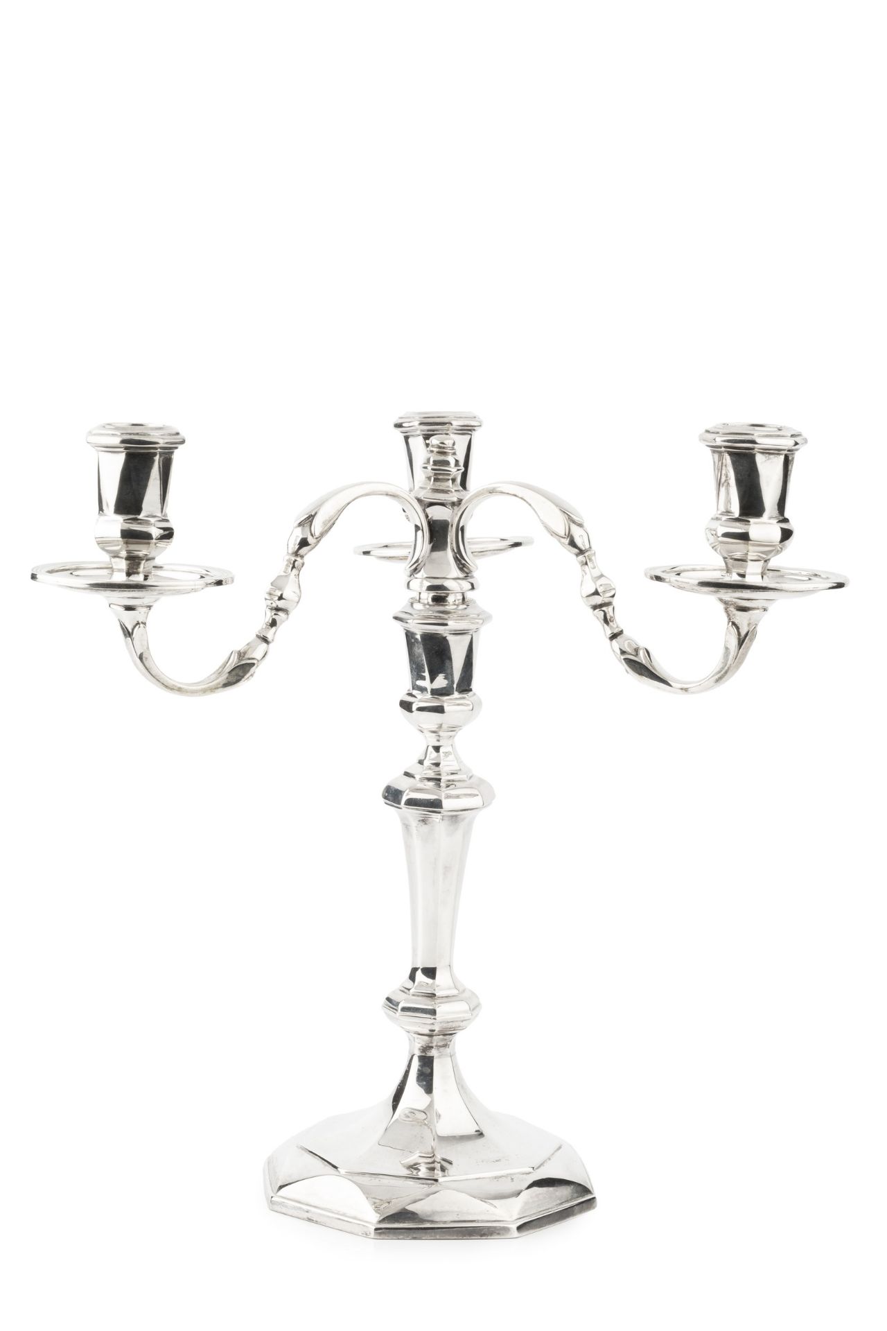 A silver three light candelabrum, the detachable branches with shaped arms, faceted nozzles and