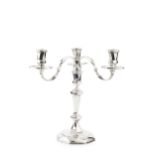 A silver three light candelabrum, the detachable branches with shaped arms, faceted nozzles and