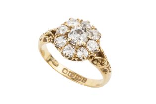 A late Victorian diamond cluster ring, the central old cut stone of approx 0.5ct within a border