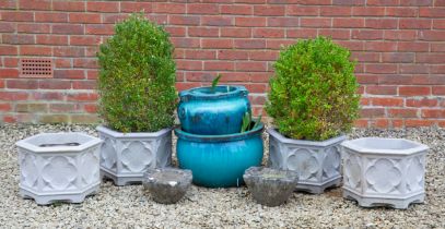 Two turquoise glazed planters, two old marble mortars, and four Gothic style planters
