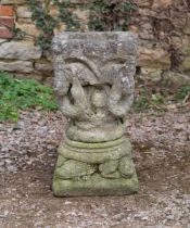 A cast stone square planter