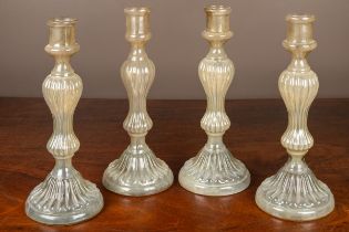 Four opalescent glass candlesticks