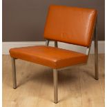 A mid-century cognac leather and chrome lounge chair
