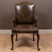 A George III mahogany framed leather upholstered library chair