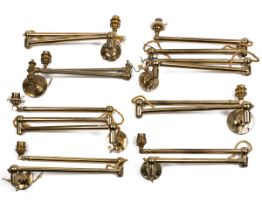 A collection of brass articulated wall lights