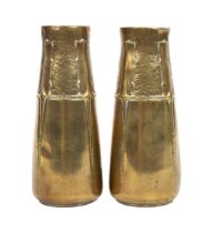 A pair of Art Nouveau brass vases