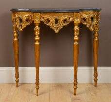 A Rococo style marble-topped gilt-painted console table