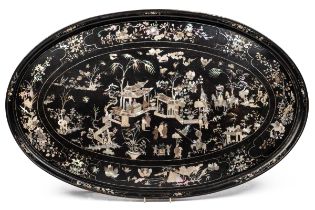 A black lacquered oval tray with mother of pearl inlay