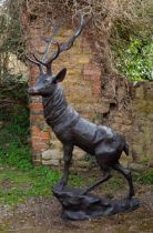 A large bronze sculpture of a stag
