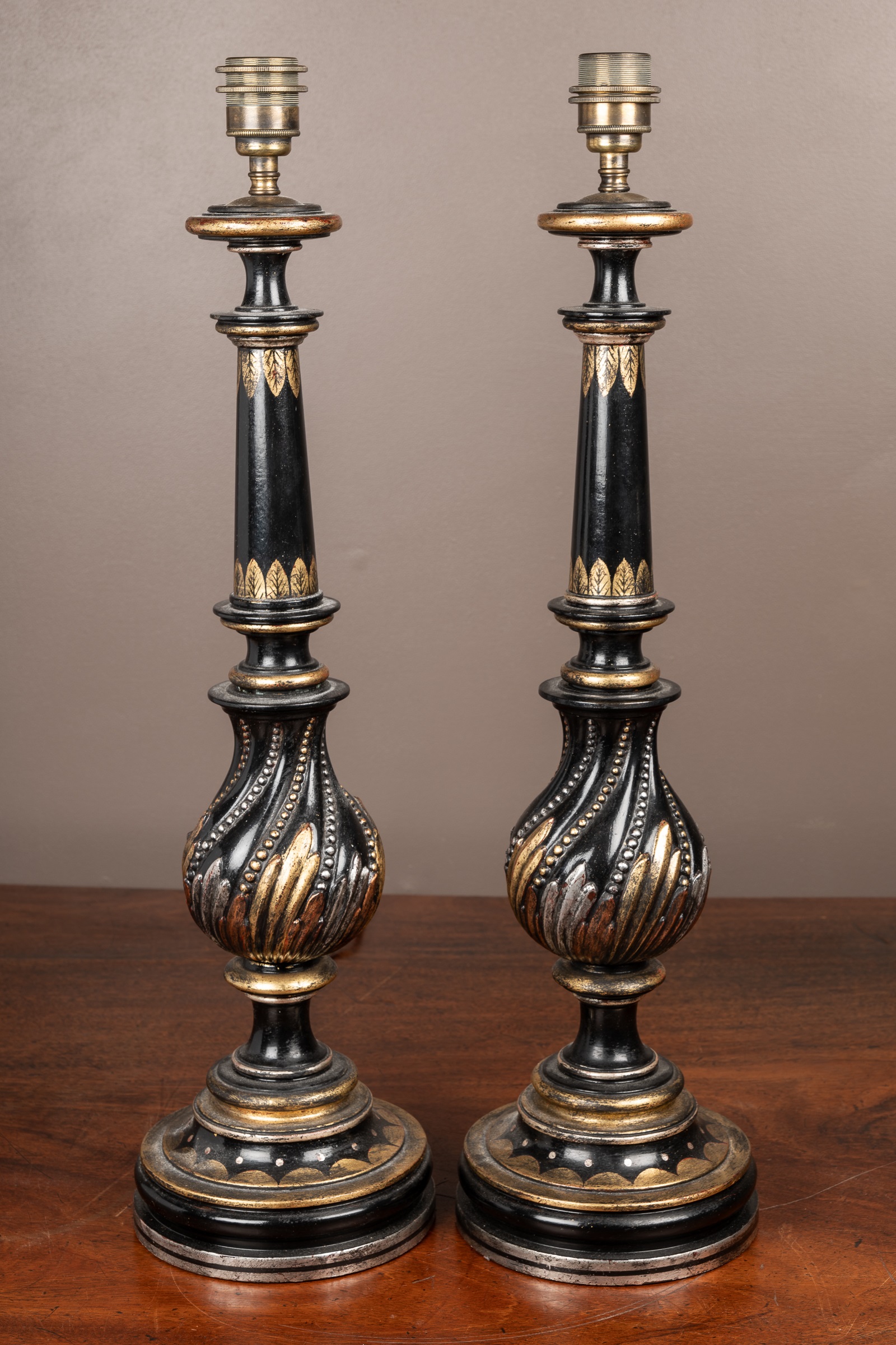A pair of metal black-painted table lamps