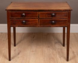 A four-drawer mahogany side table
